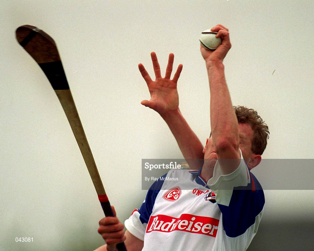 3 June 2000; Kevin Murphy of New York catches the sliothar under pressure from John Caughey of Down during the Guinness Ulster Senior Hurling Championship Quarter-Final match between Down and New York at Casement Park in Belfast, Antrim. Photo by Ray McManus/Sportsfile