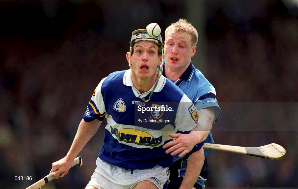 5 June 2000; Declan Rooney of Laois is put under pressure from Dublin's Liam O'Donoghue during the Guinness Leinster Senior Hurling Championship Play-off match between Dublin and Laois at O'Connor Park in Tullamore, Offaly. Photo by Damien Eagers/Sportsfile