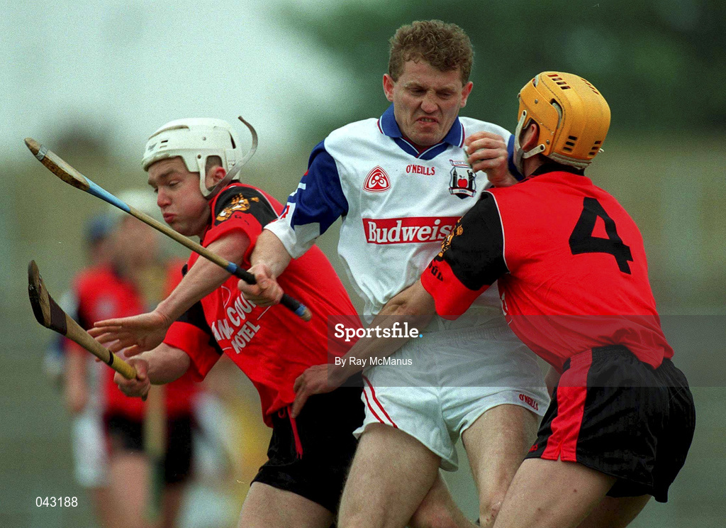 3 June 2000; Kevin Kennedy of New York under pressure from Down players John Caughey, 4, and Gary Gordan, left, during the Guinness Ulster Senior Hurling Championship Quarter-Final match between Down and New York at Casement Park in Belfast, Antrim. Photo by Ray McManus/Sportsfile