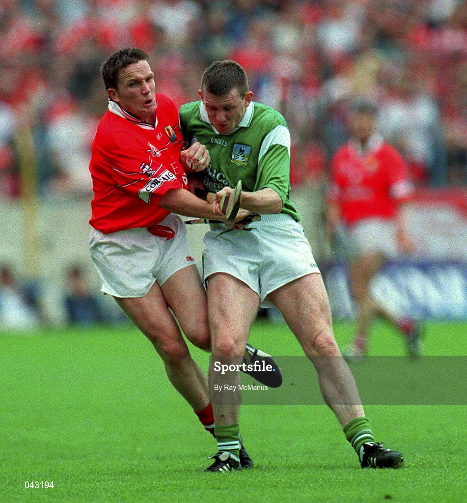 4 June 2000; Michael O'Connell of Cork in action against  Limerick's Mark Foley during the Guinness Munster Senior Hurling Championship Semi-Final match between Cork and Limerick at Semple Stadium in Thurles, Tipperary. Photo by Ray McManus/Sportsfile