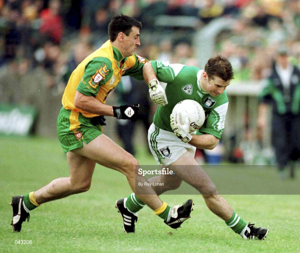 11 June 2000; Raymond Gallagher of Fermanagh in action against Mark Crossan of Donegal during the Bank of Ireland Ulster Senior Football Championship Quarter-Final match between Donegal and Fermanagh at MacCumhail Park in Ballybofey, Donegal. Photo by Ray Lohan/Sportsfile