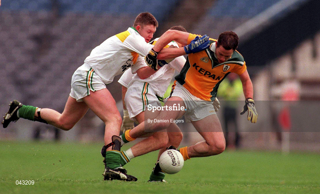 4 June 2000; Ronan Fitzsimons of Meath is tackled by Cathal Daly of Offaly during the Bank of Ireland Leinster Senior Football Championship Quarter-Final match between Offaly and Meath at Croke Park in Dublin. Photo by Damien Eagers/Sportsfile