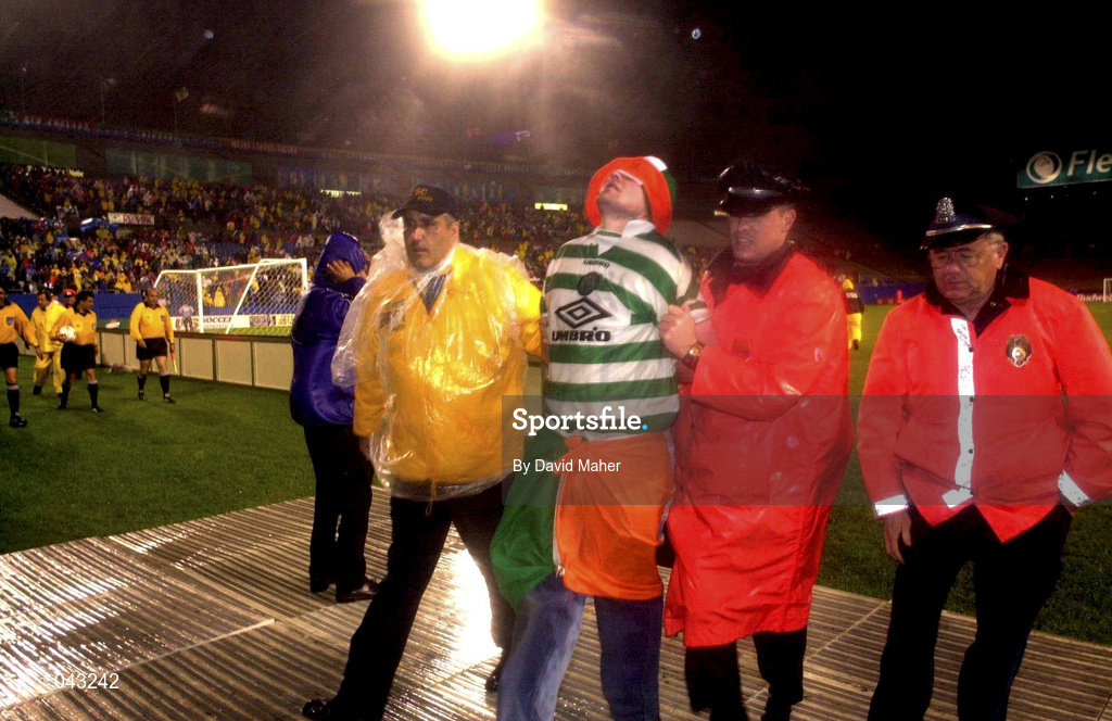 6 June 2000; Boston police remove a Republic of Ireland supporter after he entered the field of play during a delay caused by floodlight failure during the US Nike Cup match between USA and Republic of Ireland at Foxboro Stadium in Foxborough, Massachusetts, USA. Photo by David Maher/Sportsfile