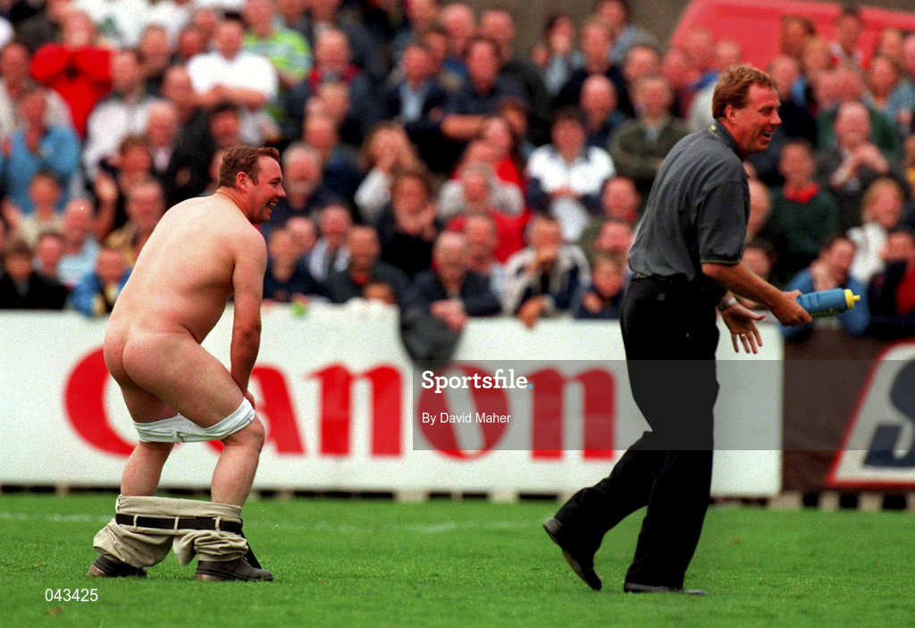 23 July 2000; West Ham United manager Harry Redknapp smiles after chasing after a streaker with a bottle of water during the Pre-Season Friendly match between St Patrick's Athletic and West Ham United at Richmond Park in Dublin. Photo by David Maher/Sportsfile