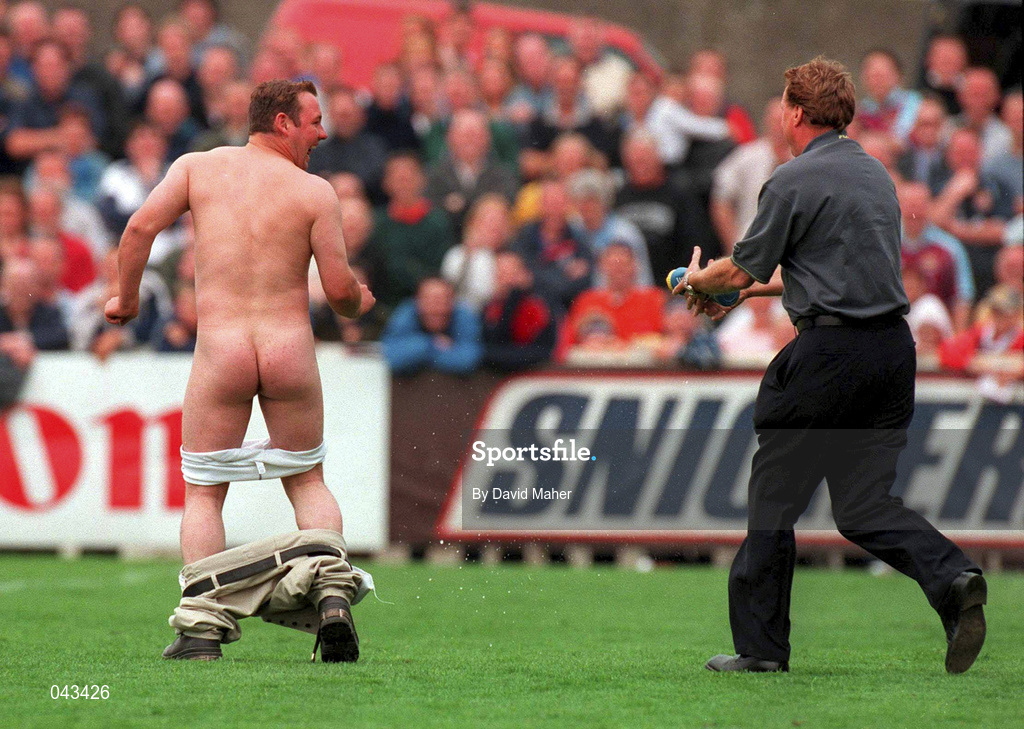 23 July 2000; West Ham United manager Harry Redknapp chases after a streaker with a bottle of water during the Pre-Season Friendly match between St Patrick's Athletic and West Ham United at Richmond Park in Dublin. Photo by David Maher/Sportsfile