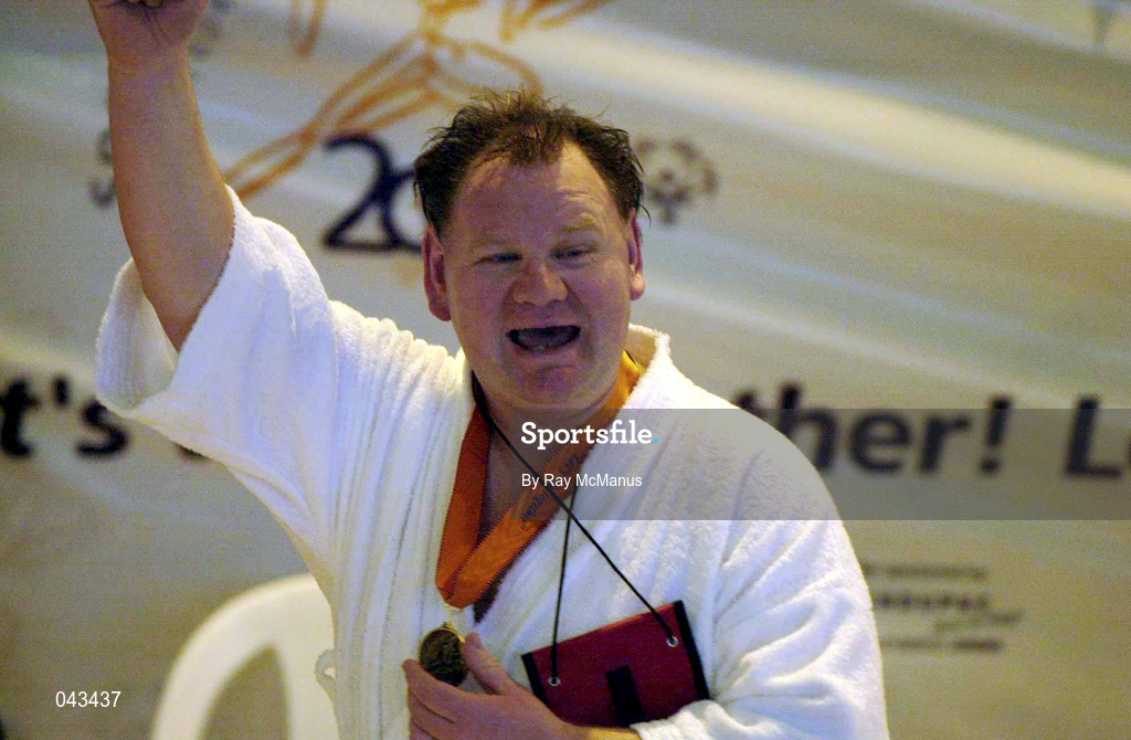 31 May 2000; Ireland's Noel Short, from Celbridge, Kildare, celebrates after receiving a gold medal after winning the 100m Breaststroke event during the Special Olympics European Games in Groningen, Netherlands. Photo by Ray McManus/Sportsfile