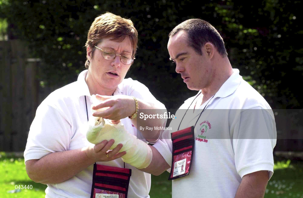 31 May 2000; Ireland's David Sheehan, from Tramore, Waterford,  is attended to by Team Ireland Medical Officer Annette Codd during the Special Olympics European Games at Groningen, Netherlands. David discolated a thumb playing Basketball for Ireland in their first game against Azerbaijan. Photo by Ray McManus/Sportsfile
