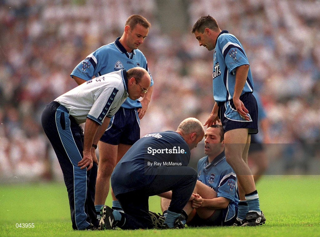 30 July 2000; Dublin's Ian Robertson is attended to by Dr Noel McCaffrey, Dublin team doctor, also pictured are Tommy Carr, Dublin manager, left, Paul Curran and Senan Connell, right, during the Bank of Ireland Leinster Senior Football Championship Final between Dublin and Kildare at Croke Park in Dublin. Photo by Ray McManus/Sportsfile