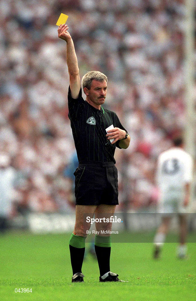 30 July 2000; Referee Paddy Russell issues a yellow card to Martin Lynch of Kildare, not pictured, during the Bank of Ireland Leinster Senior Football Championship Final between Dublin and Kildare at Croke Park in Dublin. Photo by Ray McManus/Sportsfile