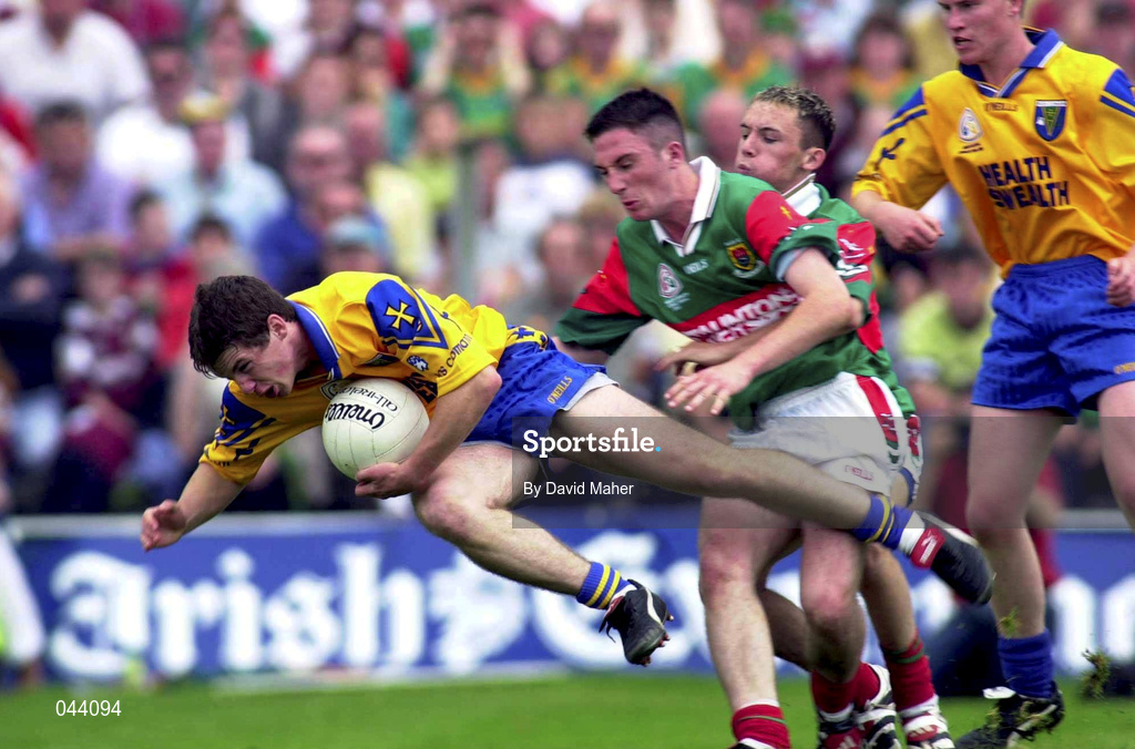 30 July 2000; Shane Sharkey of Roscommon in action against Alan Dillon and Conor Mortimer, right, of Mayo during the Connacht Minor Football Championship Final between Roscommon and Mayo at Dr Hyde Park in Roscommon. Photo by David Maher/Sportsfile