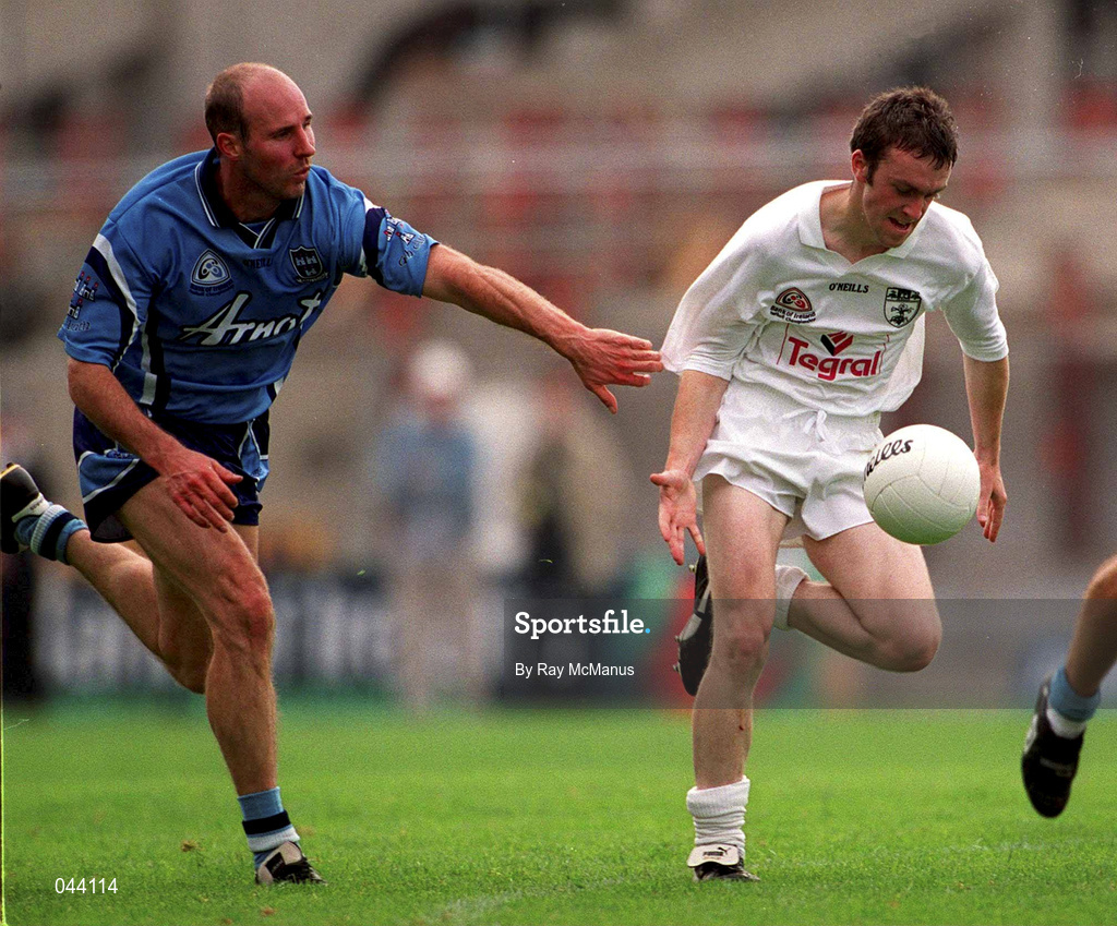 30 July 2000; Tadhg Fennin of Kildare in action against Brian Stynes of Dublin during the Bank of Ireland Leinster Senior Football Championship Final between Dublin and Kildare at Croke Park in Dublin. Photo by Ray McManus/Sportsfile