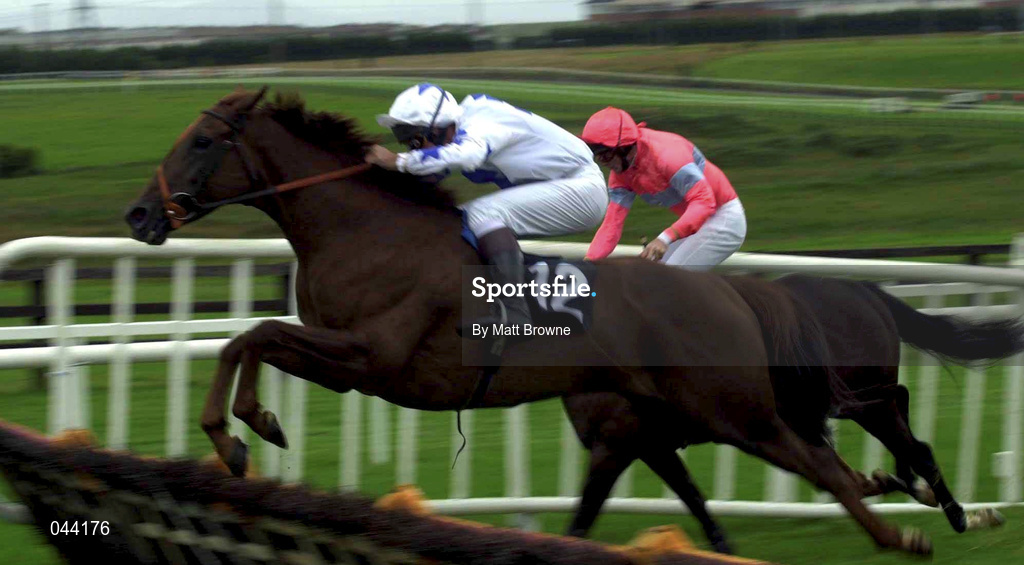 31 July 2000; Tango Pasion, with Brian Hassett up, 12, jumps the last on the way to winning the GPT Sligo Maiden Hurdle from Native Time, with Ruby Walsh up, during the opening day of the Galway Racing Festival at Galway Racecourse in Ballybrit, Galway. Photo by Matt Browne/Sportsfile