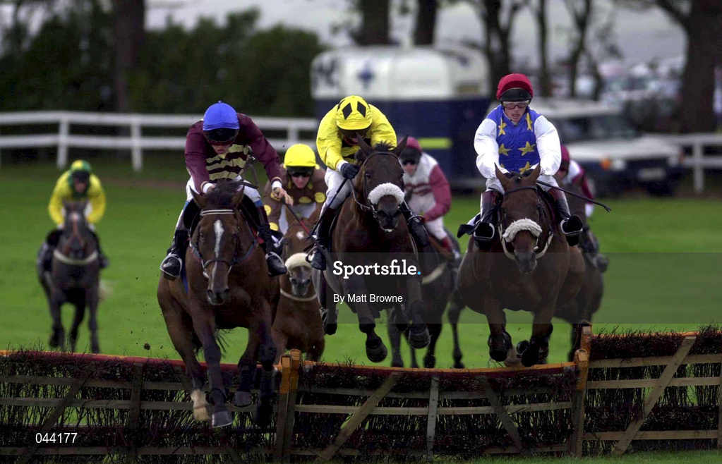 31 July 2000; Clever Consul, with Norman Williamson up, yellow silks, jumps the last to the way to winning the GPT Dublin Handicap Hurdle from eventual second place Wonder Will He, with Francis Flood, right, and third place Bart's Choice, with Ruby Walsh up, left, during the opening day of the Galway Racing Festival at Galway Racecourse in Ballybrit, Galway. Photo by Matt Browne/Sportsfile