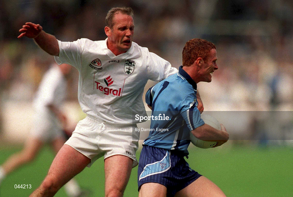 30 July 2000; Peadar Andrews of Dublin breaks through the tackle of Willie McCreery of Kildare during the Bank of Ireland Leinster Senior Football Championship Final between Dublin and Kildare at Croke Park in Dublin. Photo by Damien Eagers/Sportsfile