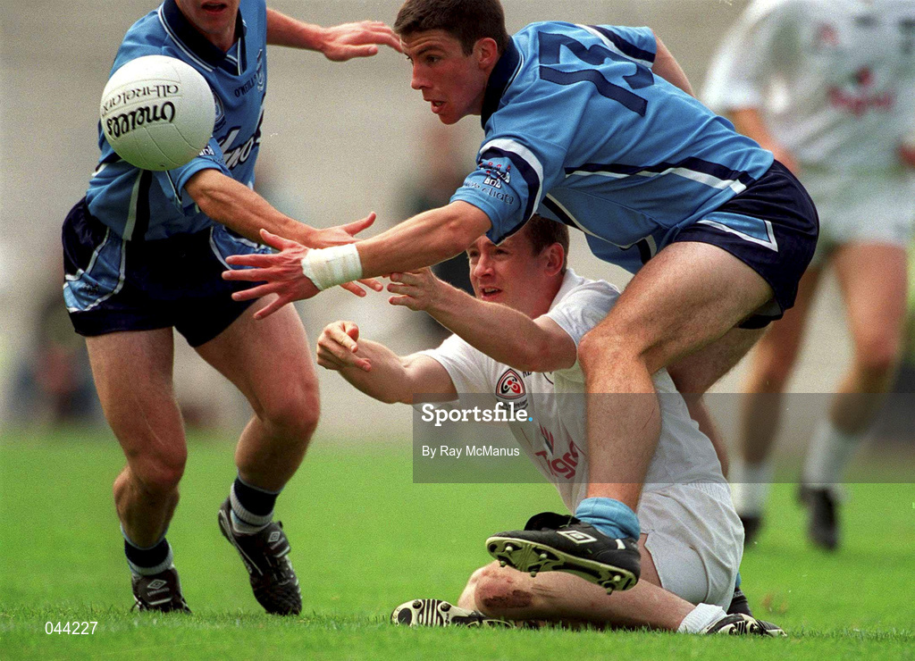 30 July 2000; John Finn of Kildare hand passes the ball away despite the attention of Colin Moran of Dublin during the Bank of Ireland Leinster Senior Football Championship Final between Dublin and Kildare at Croke Park in Dublin. Photo by Ray McManus/Sportsfile