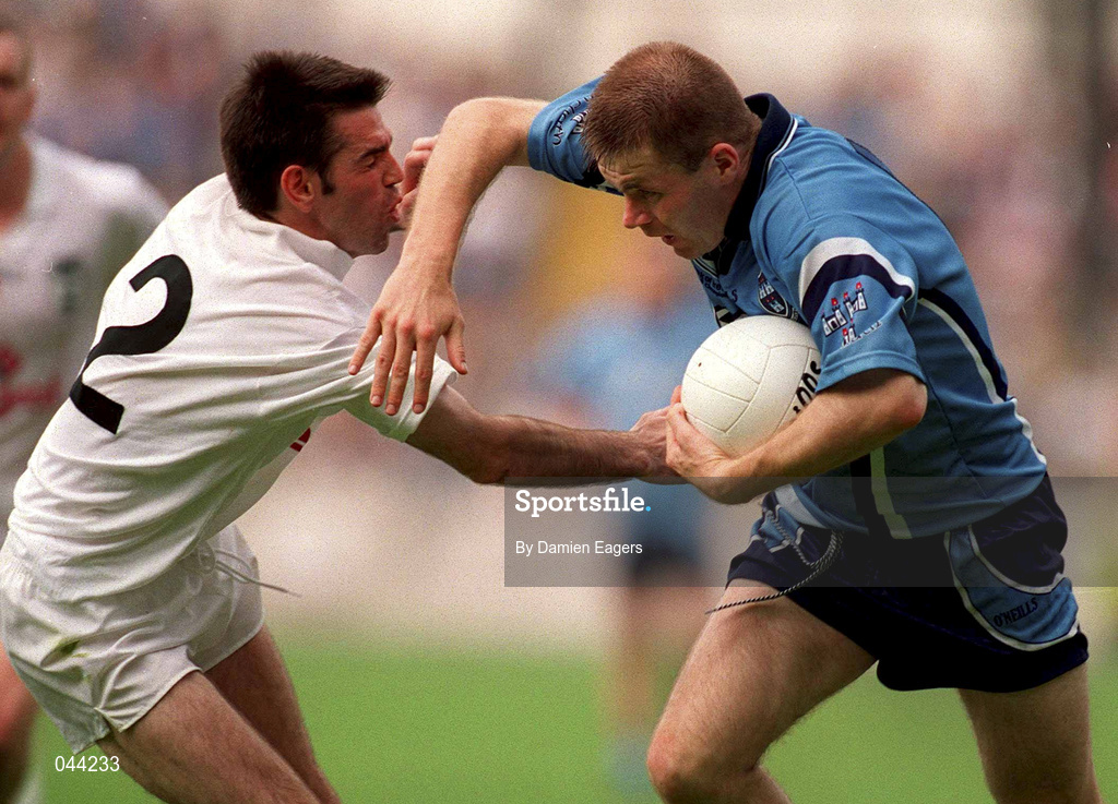 30 July 2000; Dessie Farrell of Dublin breaks through the tackle of Ken Doyle of Kildare during the Bank of Ireland Leinster Senior Football Championship Final between Dublin and Kildare at Croke Park in Dublin. Photo by Damien Eagers/Sportsfile