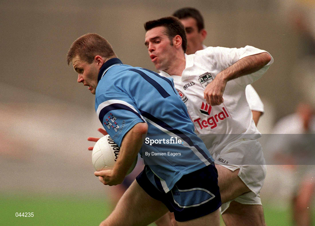 30 July 2000; Dessie Farrell of Dublin breaks through the tackle of Ken Doyle of Kildare during the Bank of Ireland Leinster Senior Football Championship Final between Dublin and Kildare at Croke Park in Dublin. Photo by Damien Eagers/Sportsfile