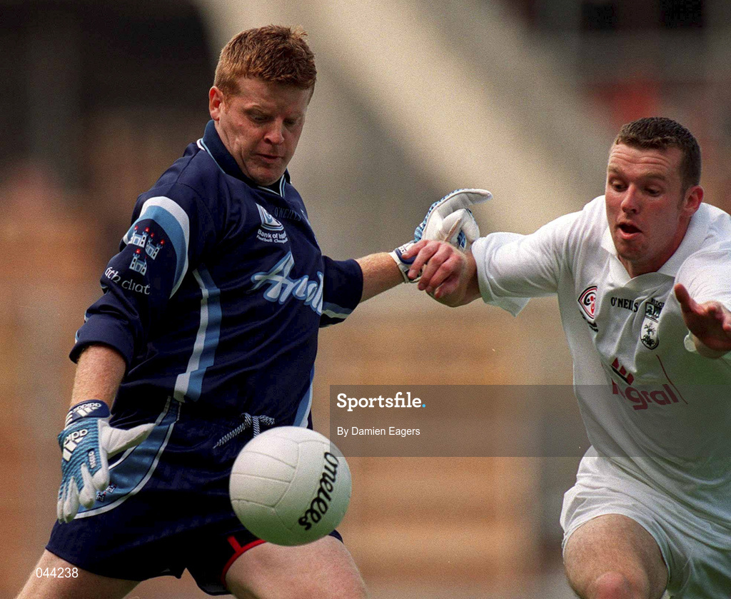 30 July 2000; Dublin goalkeeper David Byrne clears the ball despite the attention of Ronan Sweeney of Kildare during the Bank of Ireland Leinster Senior Football Championship Final between Dublin and Kildare at Croke Park in Dublin. Photo by Damien Eagers/Sportsfile