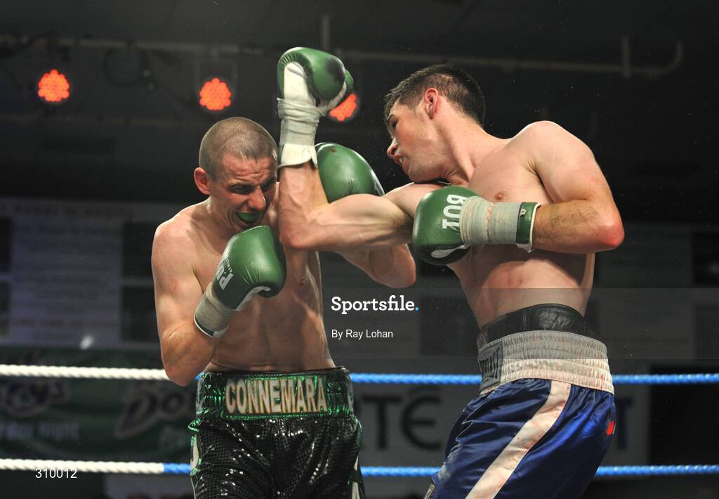 12 July 2008; Andrew Murray, right, lands a punch on Peter McDonagh. Irish Lightweight Championship, Hunky Dory Fight Night, Irish Lighweight Championship, National Stadium, Dublin. Picture credit: Ray Lohan / SPORTSFILE *** Local Caption ***
