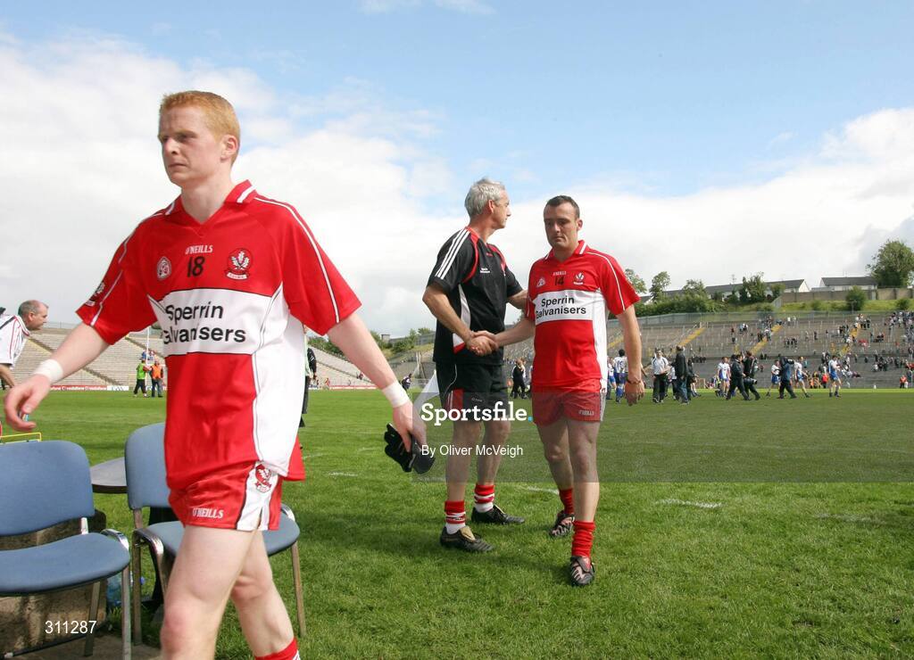 19 July 2008; Derry trainer, John McCloskey, commiserates with Paddy Bradley as he leaves the field, Derry. GAA Football All-Ireland Senior Championship Qualifier - Round 1, Monaghan v Derry. Clones, Co. Monaghan. Picture credit: Oliver McVeigh / SPORTSFILE