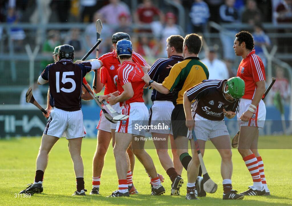 19 July 2008; Referee Barry Kelly seperates players from both sides late in the first-half. GAA Hurling All-Ireland Senior Championship Qualifier - Round 4, Cork v Galway, Thurles, Co. Tipperary. Picture credit: Ray McManus / SPORTSFILE