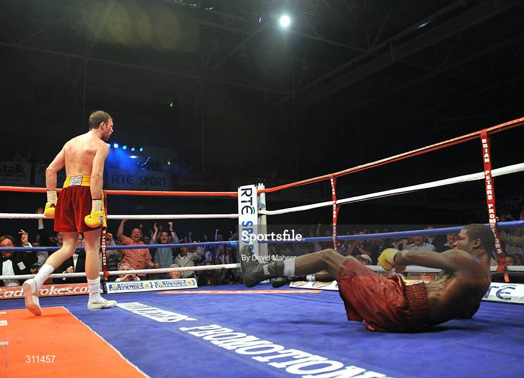 19 July 2008; Andy Lee, left, knocks down Willie Gibbs during the final round. International Middleweight contest, University Sports Arena, Limerick. Picture credit: David Maher / SPORTSFILE