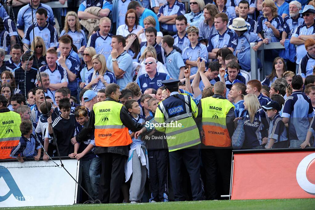 20 July 2008; Supporters on Hill 16 are held back by a member of the Garda and security personal during the closing moments of the match. GAA Football Leinster Senior Championship Final, Dublin v Wexford, Croke Park, Dublin. Picture credit: David Maher / SPORTSFILE