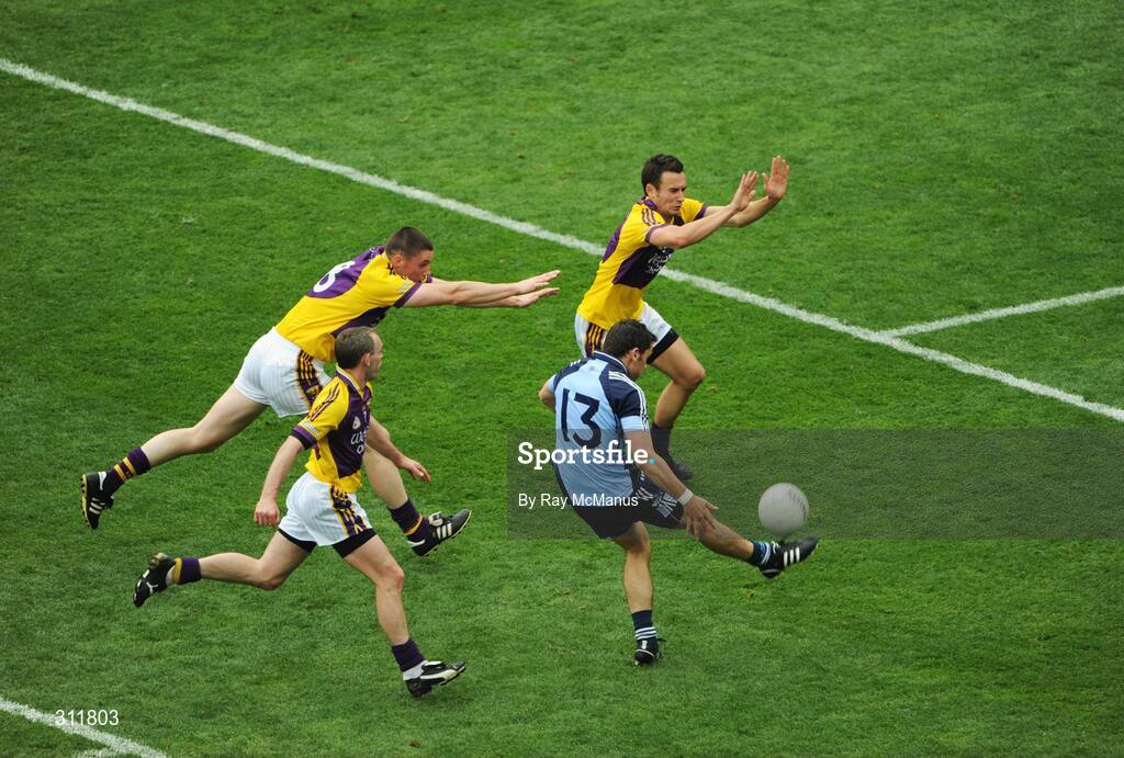 20 July 2008; Alan Brogan, Dublin, shoots goalwards under pressure from Wexford players Adrian Morrissey, right, Thomas Howlin and Colm Morris. GAA Football Leinster Senior Championship Final, Dublin v Wexford, Croke Park, Dublin. Picture credit: Ray McManus / SPORTSFILE