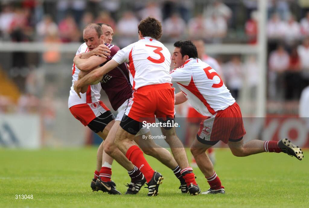 26 July 2008; John Smyth, Westmeath, in action against Brian Dooher, left, Justin McMahon and Davy Harte, right, Tyrone. GAA Football All-Ireland Senior Championship Qualifier, Round 2, Tyrone v Westmeath, Healy Park, Omagh, Co. Tyrone. Photo by Sportsfile