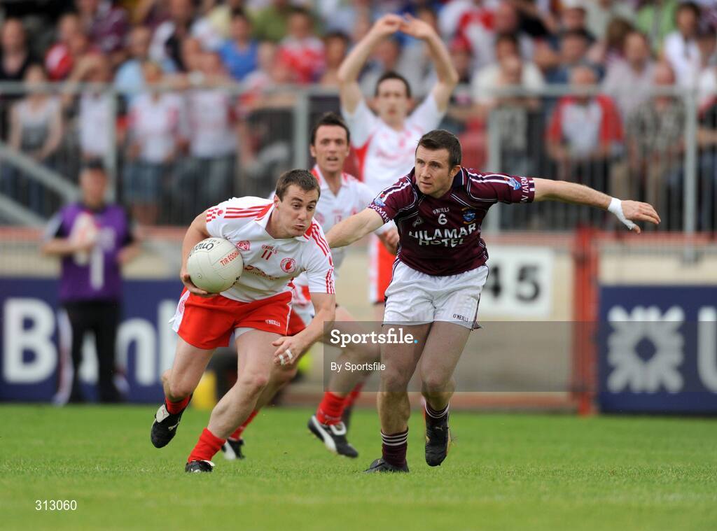 26 July 2008; Brian McGuigan, Tyrone, in action against Derek Heavin, Westmeath. GAA Football All-Ireland Senior Championship Qualifier - Round 2, Tyrone v Westmeath, Healy Park, Omagh, Co. Tyrone. Photo by Sportsfile