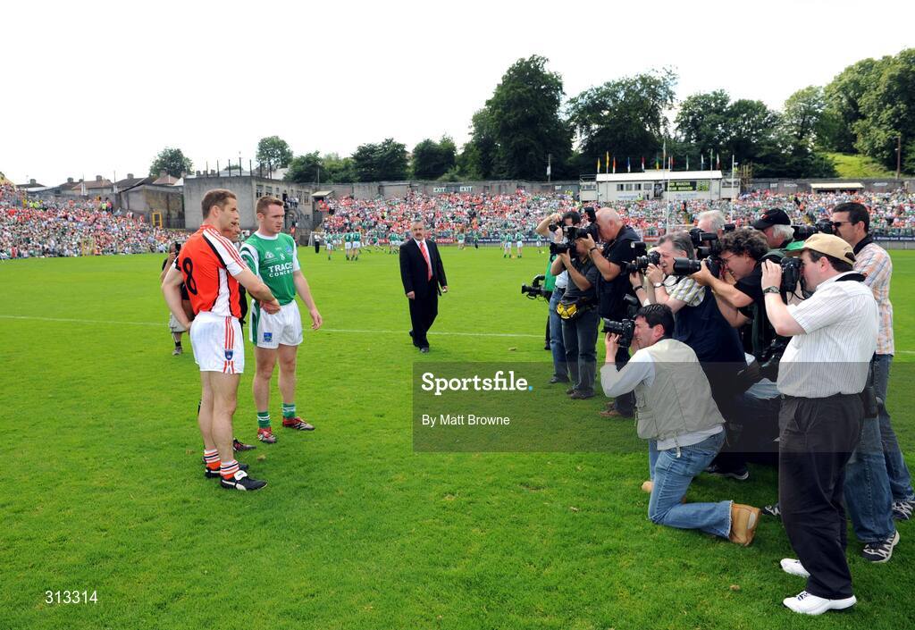 27 July 2008; Armagh captain Paul McGrane and Fermanagh captain Martin McGrath have their picture taken before the start of the game with referee Maurice Deegan. GAA Football Ulster Senior Championship Final, Armagh v Fermanagh, St Tighearnach's Park, Clones, Co. Monaghan. Picture credit: Matt Browne / SPORTSFILE