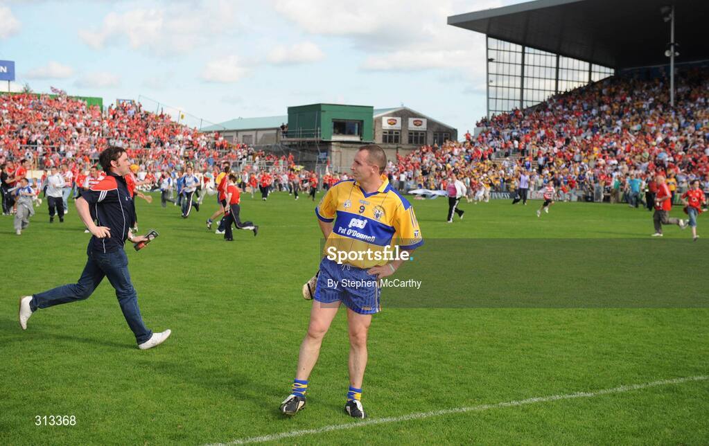 27 July 2008; A dejected Colin Lynch, Clare, as the Cork supporters invade the pitch. GAA Hurling All-Ireland Senior Championship Quarter-Final, Clare v Cork, Semple Stadium, Thurles, Co. Tipperary. Picture credit: Stephen McCarthy / SPORTSFILE