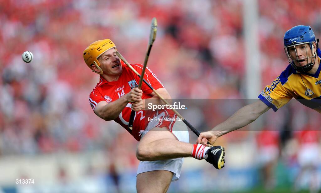 27 July 2008; Joe Deane, Cork, has his shot blocked by Clare full-back Frank Lohan. GAA Hurling All-Ireland Senior Championship Quarter-Final, Clare v Cork, Semple Stadium, Thurles, Co. Tipperary. Picture credit: Ray McManus / SPORTSFILE