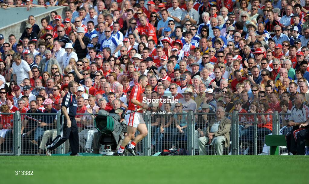 27 July 2008; Cork full-back Diarmuid O'Sullivan, who was substituted, leaves the field under the watchful eyes of manager Gerald McCarthy and former Tipperary County Board Secretary Tommy Barrett. GAA Hurling All-Ireland Senior Championship Quarter-Final, Clare v Cork, Semple Stadium, Thurles, Co. Tipperary. Picture credit: Ray McManus / SPORTSFILE