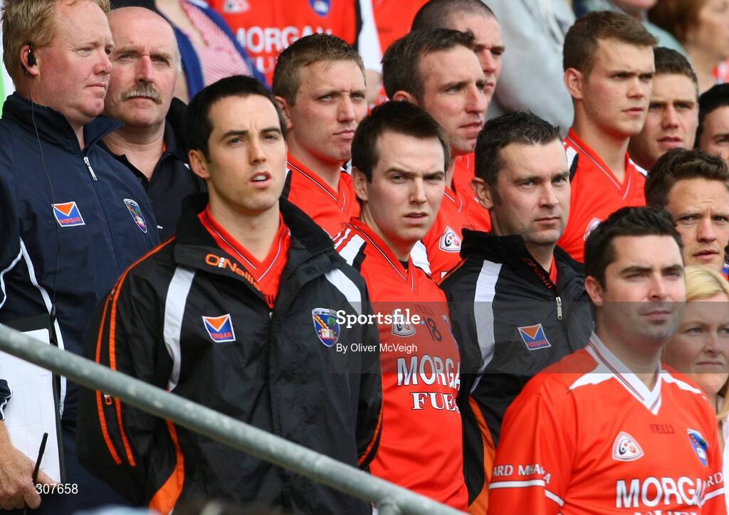 29 June 2008; Armagh players Aaron Kernan, Tony Kernan and Oisin McConville, stand, on the subs bench, for the National Anthem. GAA Football Ulster Senior Championship Semi-Final, Down v Armagh, St Tighearnach's Park, Clones, Co. Monaghan. Picture credit: Oliver McVeigh / SPORTSFILE