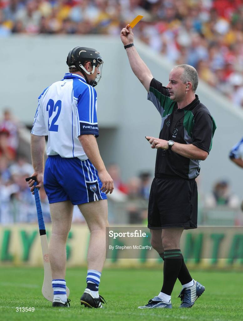 27 July 2008; Kevin Moran, Waterford, receives a yellow card from referee John Sexton, Cork. GAA Hurling All-Ireland Senior Championship Quarter-Final, Wexford v Waterford, Semple Stadium, Thurles, Co. Tipperary. Picture credit: Stephen McCarthy / SPORTSFILE