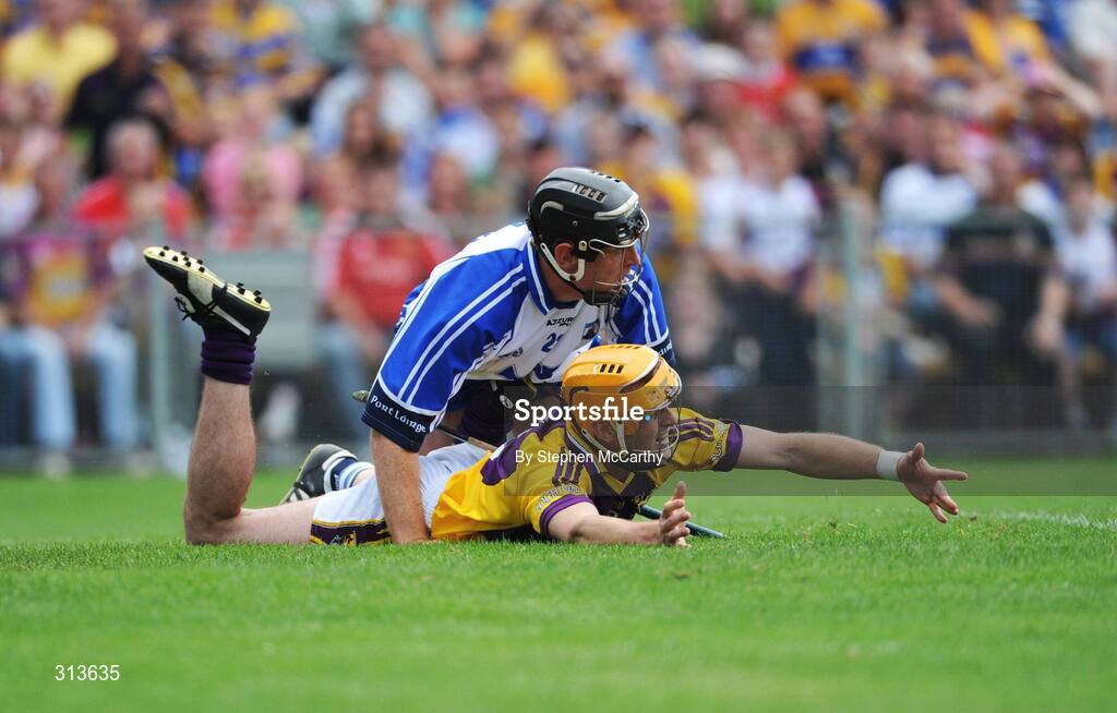 27 July 2008; Eoin Quigley, Wexford, is brought to ground by Kevin Moran, Waterford, for which referee John Sexton, Cork, awarded a penalty. GAA Hurling All-Ireland Senior Championship Quarter-Final, Wexford v Waterford, Semple Stadium, Thurles, Co. Tipperary. Picture credit: Stephen McCarthy / SPORTSFILE *** Local Caption *** 22