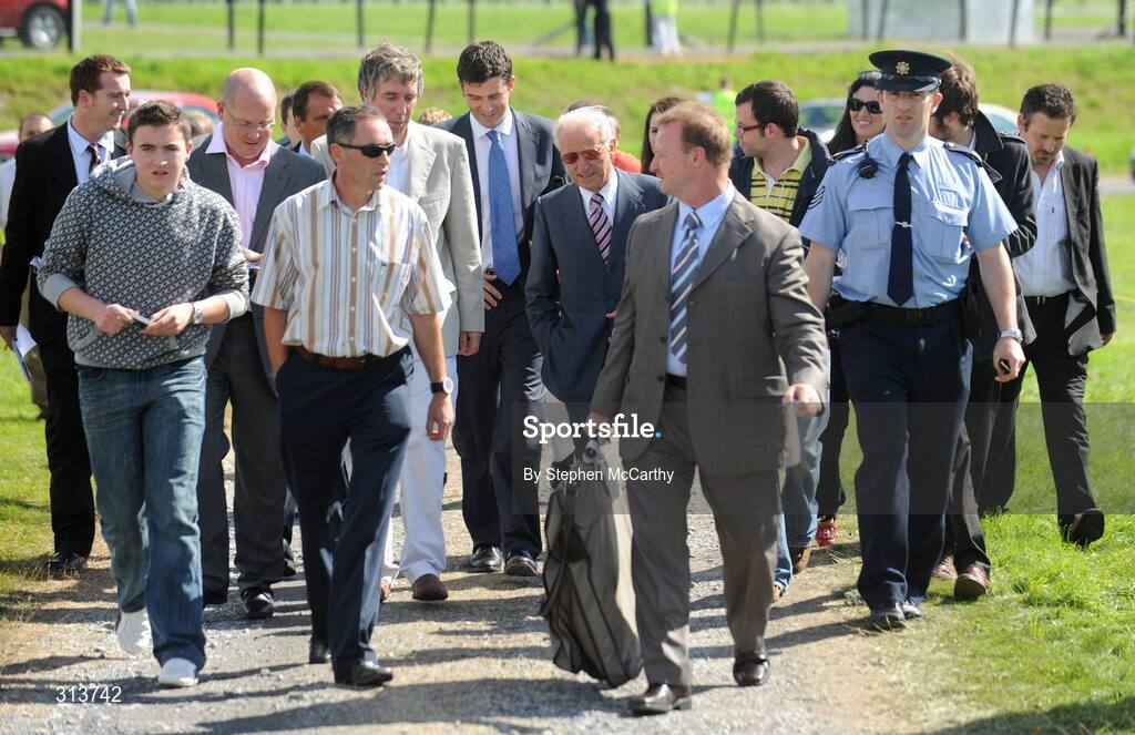 29 July 2008; Republic of Ireland manager Giovanni Trapattoni arrives for the the second day of the Galway Racing Festival accompanied by FAI Director of Communications Peter Sherard, left, FAI Chief Executive John Delaney, journalists and security. Galway Racing Fesitval - Tuesday, Ballybrit, Galway. Picture credit: Stephen McCarthy / SPORTSFILE