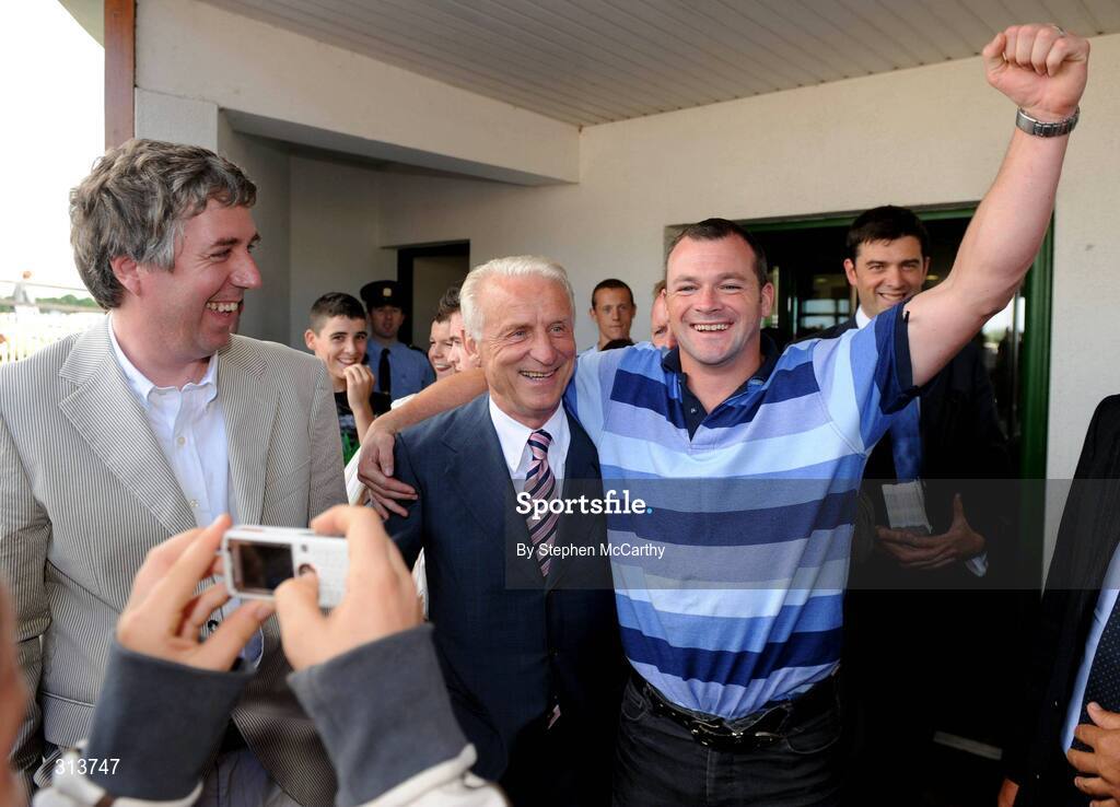 29 July 2008; Republic of Ireland manager Giovanni Trapattoni accompanied by FAI Chief Executive John Delaney is greeted by Micheal James Reilly, Cavan, as he arrives for the the second day of the Galway Racing Festival. Galway Racing Festival - Tuesday, Ballybrit, Galway. Picture credit: Stephen McCarthy / SPORTSFILE
