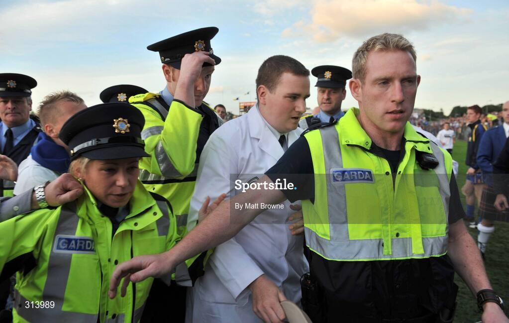 30 July 2008; An umpire is escorted by Gardai after the game. Bord Gais Munster GAA Hurling U21 Championship Final, Clare v Tipperary, Cusack Park, Ennis, Co. Clare. Picture credit: Matt Browne / SPORTSFILE