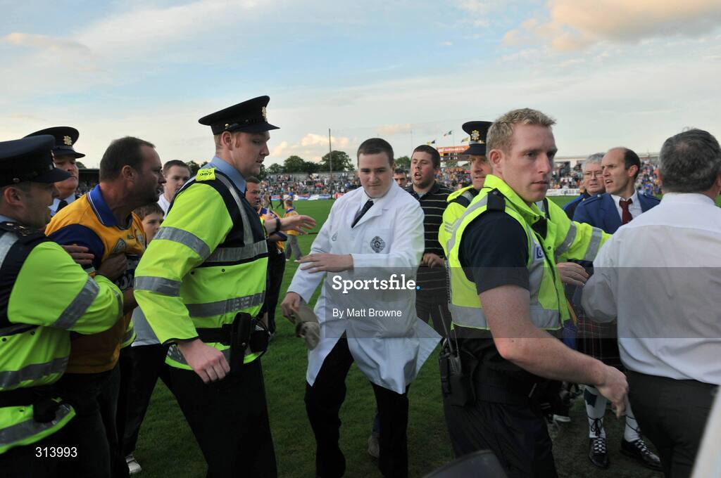 30 July 2008; An umpire is escorted by Gardai after the game. Bord Gais Munster GAA Hurling U21 Championship Final, Clare v Tipperary, Cusack Park, Ennis, Co. Clare. Picture credit: Matt Browne / SPORTSFILE