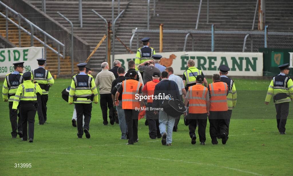 30 July 2008; The referee, linesmen and umpires are escorted by Gardai after the game. Bord Gais Munster GAA Hurling U21 Championship Final, Clare v Tipperary, Cusack Park, Ennis, Co. Clare. Picture credit: Matt Browne / SPORTSFILE