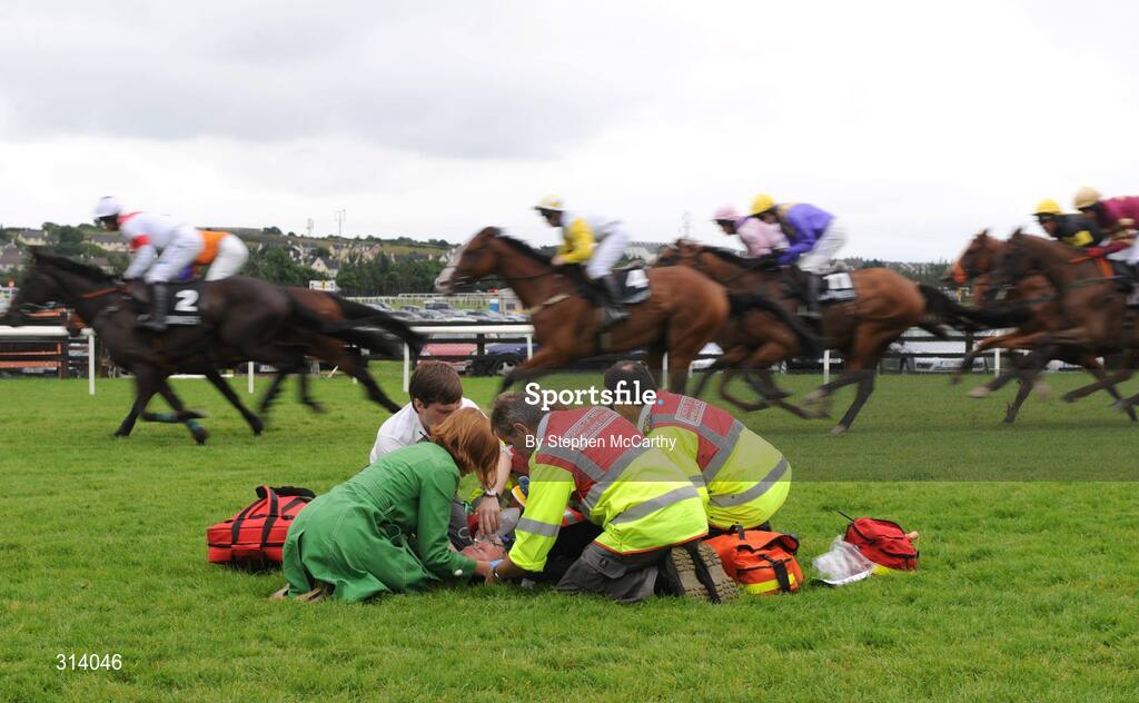31 July 2008; Jockey Stephen Carey is attended to by medical staff after his mount Captain Lyford unseated him during the Guinness Beginners Chase. Galway Racing Festival, Ballybrit, Co. Galway. Picture credit: Stephen McCarthy / SPORTSFILE