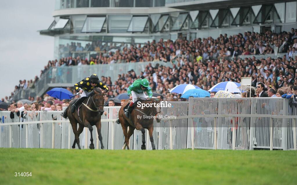 31 July 2008; Eventual winner Skip Two, with Barry Cash up, battles it out on the run up to the finshing post with eventual second Dreamy Gent, with Andrew Leigh up, right, during the Guinness Novice Chase. Galway Racing Festival, Ballybrit, Co. Galway. Picture credit: Stephen McCarthy / SPORTSFILE