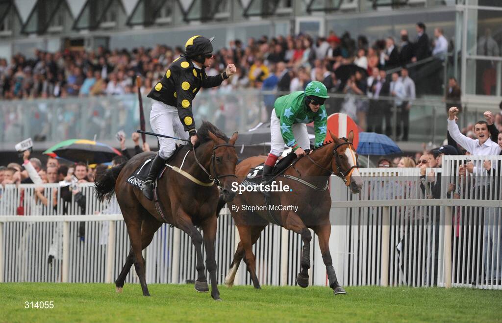 31 July 2008; Jockey Barry Cash celebrates after winning the Guinness Novice Chase onboard Skip Two from second place Dreamy Gent, with Andrew Leigh up. Galway Racing Festival, Ballybrit, Co. Galway. Picture credit: Stephen McCarthy / SPORTSFILE