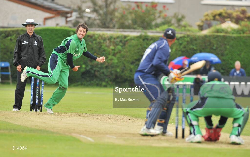 31 July 2008; Kyle McCallan, Ireland, takes the wicket of Scotland captain Ryan Watson watched by test match umpire Billy Bowden from New Zealand. Ireland v Scotland, One Day International, Clontarf Cricket Club, Dublin. Picture credit: Matt Browne / SPORTSFILE