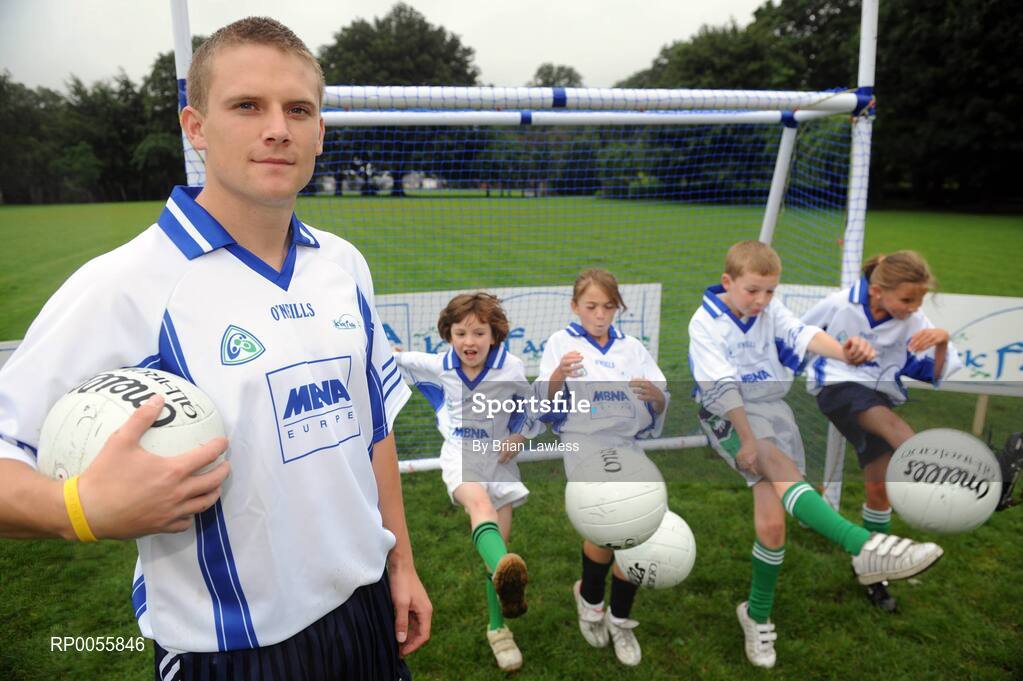 31 July 2008; The 9th annual MBNA Kick Fada competition was launched at Herbert Park, over 20 Inter-County Gaelic Football stars are set to compete for the prestigious All-Ireland title at the 2008 MBNA Kick Fada Final, which takes place on Saturday 13th at Bray Emmets GAA Club. Reigning champion John Brennan, from Carlow, will be back to defend his title after winning with a kick of 67 metres. At the launch is Dublin master free taker Tomas Quinn with Bray Emmets GAA club members, from left, Olivia Duffy, Meghan Donegan, Owen Duffy, and Aoife Connaughton. Herbert Park Hotel, Ballsbridge, Dublin. Picture credit: Brian Lawless / SPORTSFILE