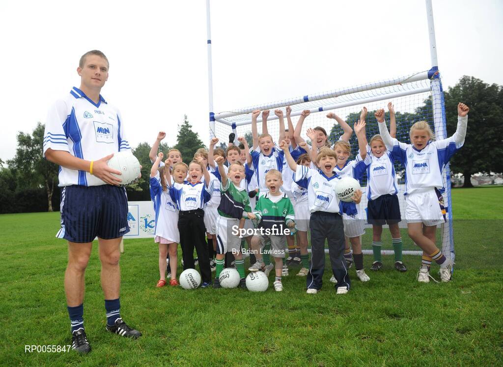 31 July 2008; The 9th annual MBNA Kick Fada competition was launched at Herbert Park, over 20 Inter-County Gaelic Football stars are set to compete for the prestigious All-Ireland title at the 2008 MBNA Kick Fada Final, which takes place on Saturday 13th at Bray Emmets GAA Club. Reigning champion John Brennan, from Carlow, will be back to defend his title after winning with a kick of 67 metres. At the launch is Dublin master free taker Tomas Quinn cheered on by children from Kilmacud Crokes GAA club, Raheny GAA club, Holy Trinity School, and Bray Emmets GAA. Herbert Park Hotel, Ballsbridge, Dublin Picture credit: Brian Lawless / SPORTSFILE