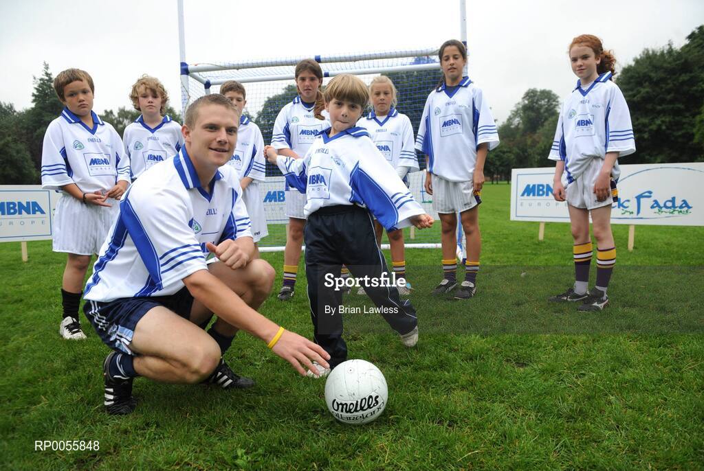 31 July 2008; The 9th annual MBNA Kick Fada competition was launched at Herbert Park, over 20 Inter-County Gaelic Football stars are set to compete for the prestigious All-Ireland title at the 2008 MBNA Kick Fada Final, which takes place on Saturday 13th at Bray Emmets GAA Club. Reigning champion John Brennan, from Carlow, will be back to defend his title after winning with a kick of 67 metres. At the launch is Dublin master free taker Tomas Quinn with Dylan Gray, age 9, Bray Emmets GAA club, and from left, Ben O'Leary, St. John's GAA, Mark O'Leary, St. John's GAA, Thomas Butterly, Raheny GAA, Ali Byrne, Holly Greer, Molly Lamb, and Rachel Gallagher, Kilmacud Crokes GAA. Herbert Park Hotel, Ballsbridge, Dublin Picture credit: Brian Lawless / SPORTSFILE