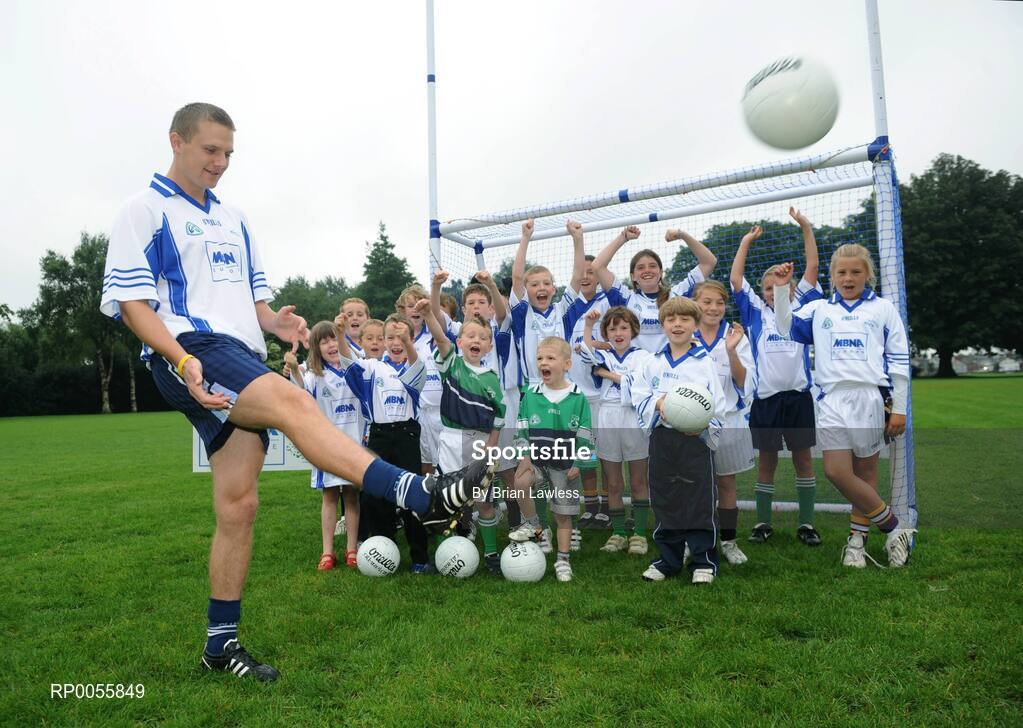 31 July 2008; The 9th annual MBNA Kick Fada competition was launched at Herbert Park, over 20 Inter-County Gaelic Football stars are set to compete for the prestigious All-Ireland title at the 2008 MBNA Kick Fada Final, which takes place on Saturday 13th at Bray Emmets GAA Club. Reigning champion John Brennan, from Carlow, will be back to defend his title after winning with a kick of 67 metres. At the launch is Dublin master free taker Tomas Quinn cheered on by children from Kilmacud Crokes GAA club, Raheny GAA club, Holy Trinity School, and Bray Emmets GAA. Herbert Park Hotel, Ballsbridge, Dublin Picture credit: Brian Lawless / SPORTSFILE